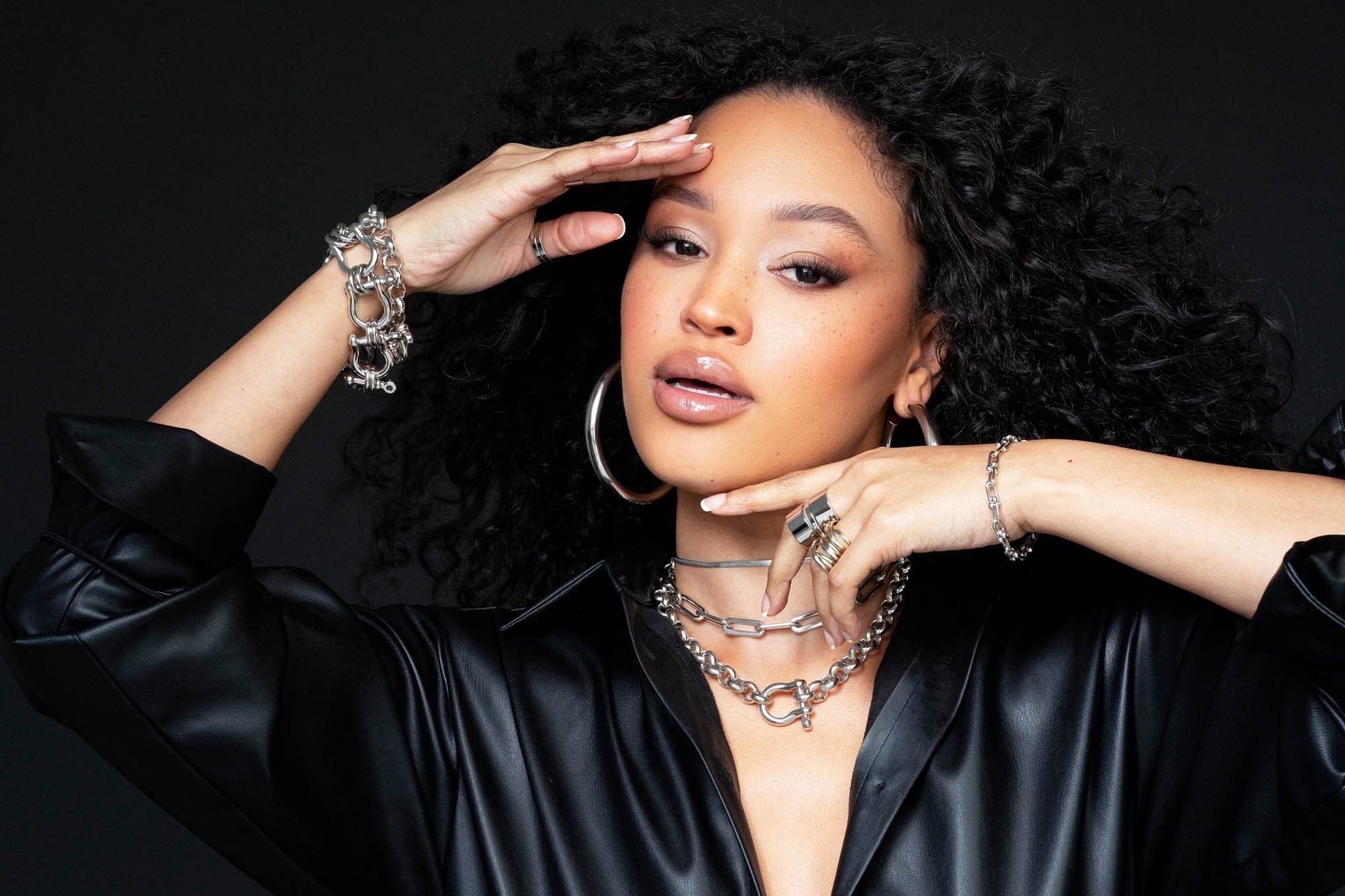 Model with silver rings and bracelet on with Royal Necklace around her neck