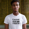 Person wearing a white t-shirt with text 'It's ok to have Jesus and a therapist too.' against a blurred background.