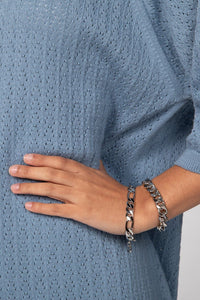 A woman wearing two Taraji Bracelet