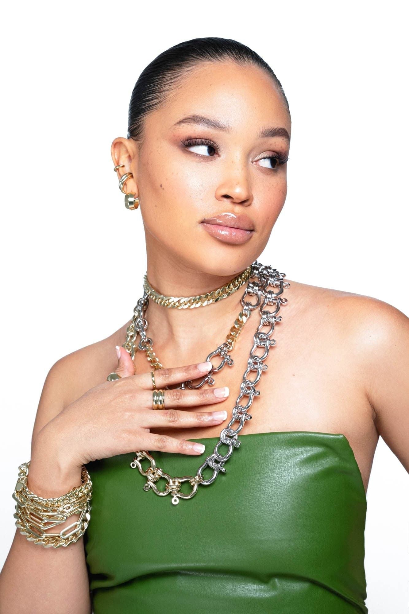 A woman wearing many neckless