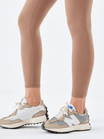A picture of woman wearing Wide Waistband Sports Leggings – Essential Colors