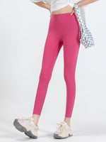 Front view of pink Wide Waistband Sports Leggings – Essential Colors