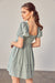 Model showing back of FRONT RUCHED DETAIL PUFF SLEEVE DRESS