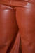 Close up view of Plus Size PU Leather Slit Waist Hem Pants