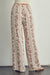 View of the back of Palazzo pants in floral rayon gauze-cream