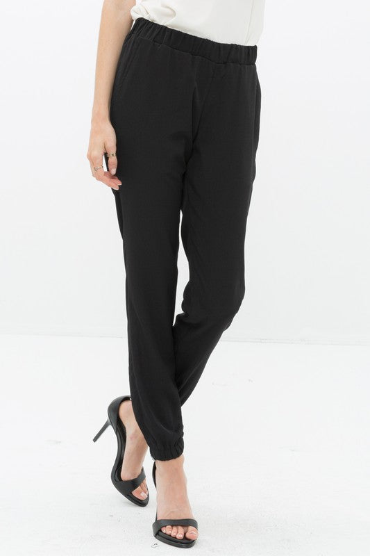 Zoom in view of Ro &amp; De Ankle Cuffed Black Crepe Pants In Black