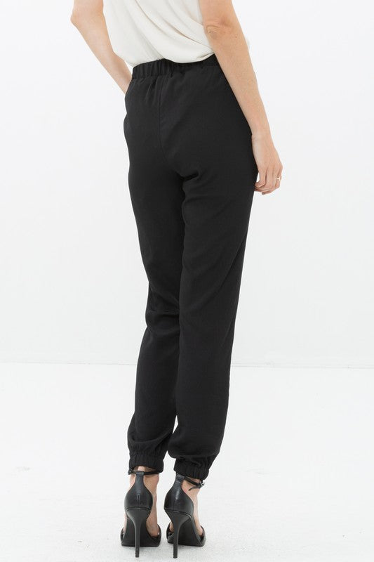 Back of Ro &amp; De Ankle Cuffed Black Crepe Pants In Black