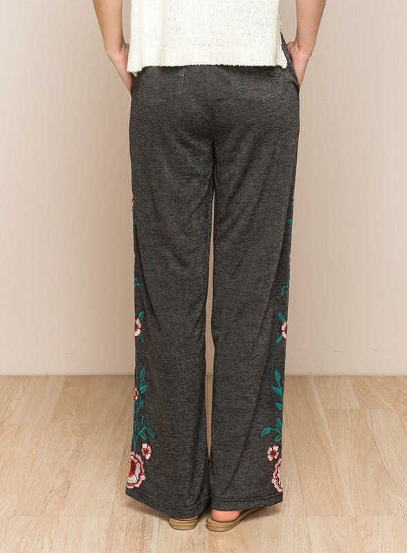 Back view of LONG FLORAL EMBROIDERED WIDE LEGGED PANTS