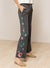 Side view of LONG FLORAL EMBROIDERED WIDE LEGGED PANTS