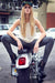 Model sitting on a bike showing Womens Herringbone Jeggings-navy blue