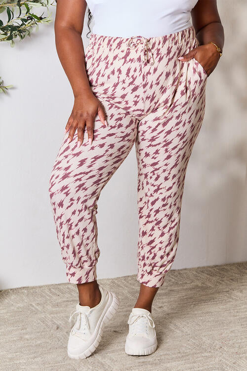 Front view of Heimish Full Size Printed Drawstring Pants