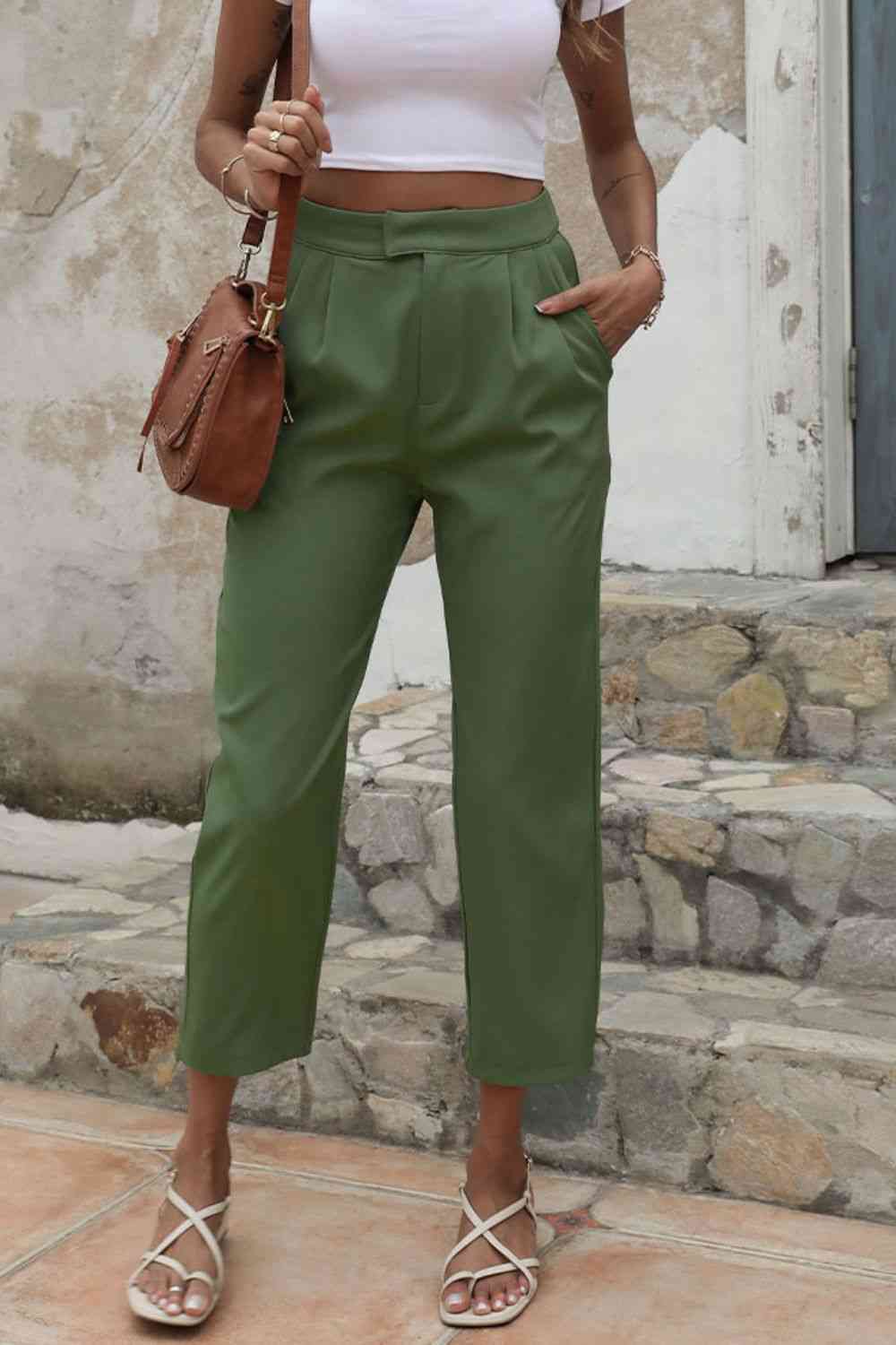 Model showing left pocket of Straight Leg Cropped Pants with Pockets