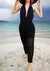 Model on the beach wearing PANTS LOOSE ELASTIC WAIST