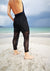 Lady on the beach showing the back of PANTS LOOSE ELASTIC WAIST