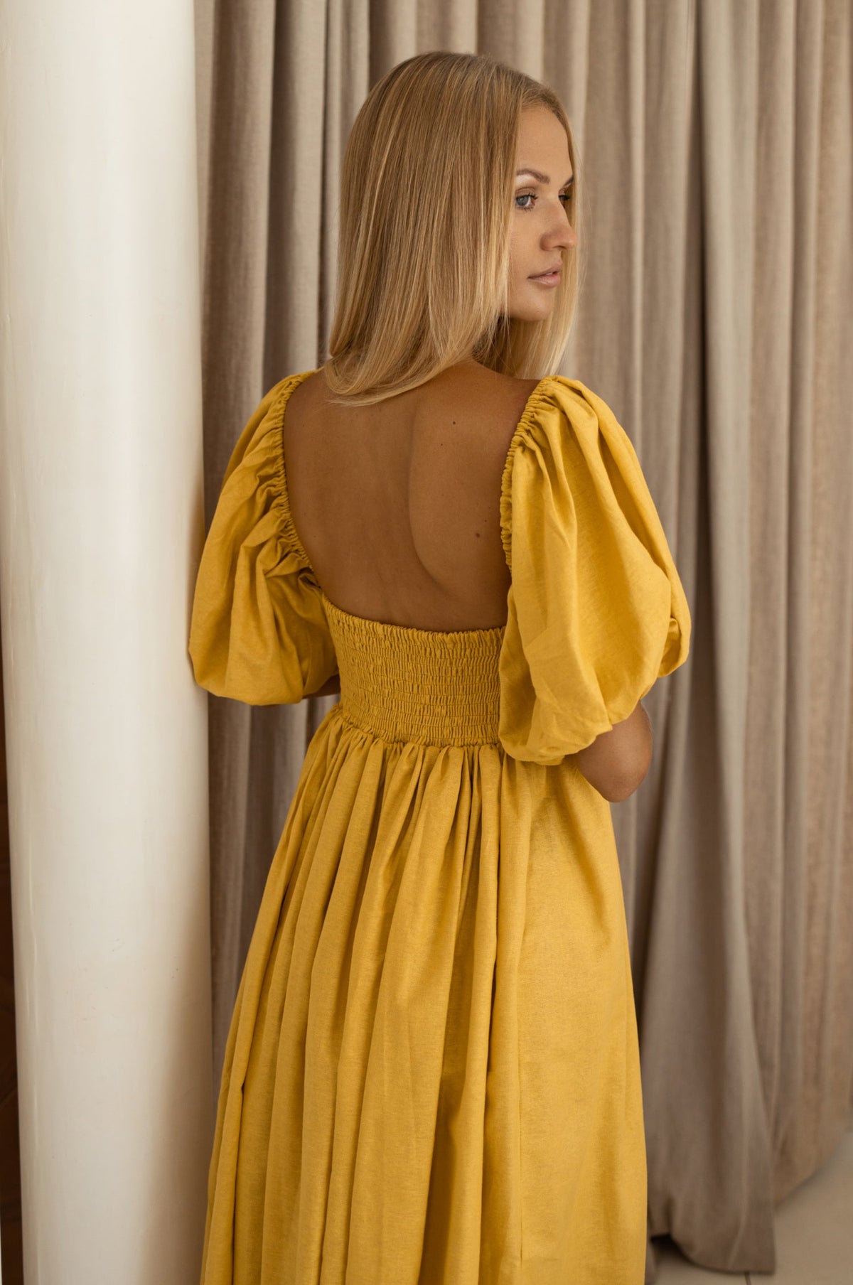 Back view of Back of Cherie Puff Sleeve Midi dress- honey cream