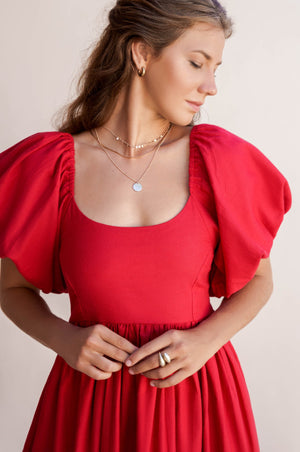 Close up view of details on Cherie Puff Sleeve Midi dress-red
