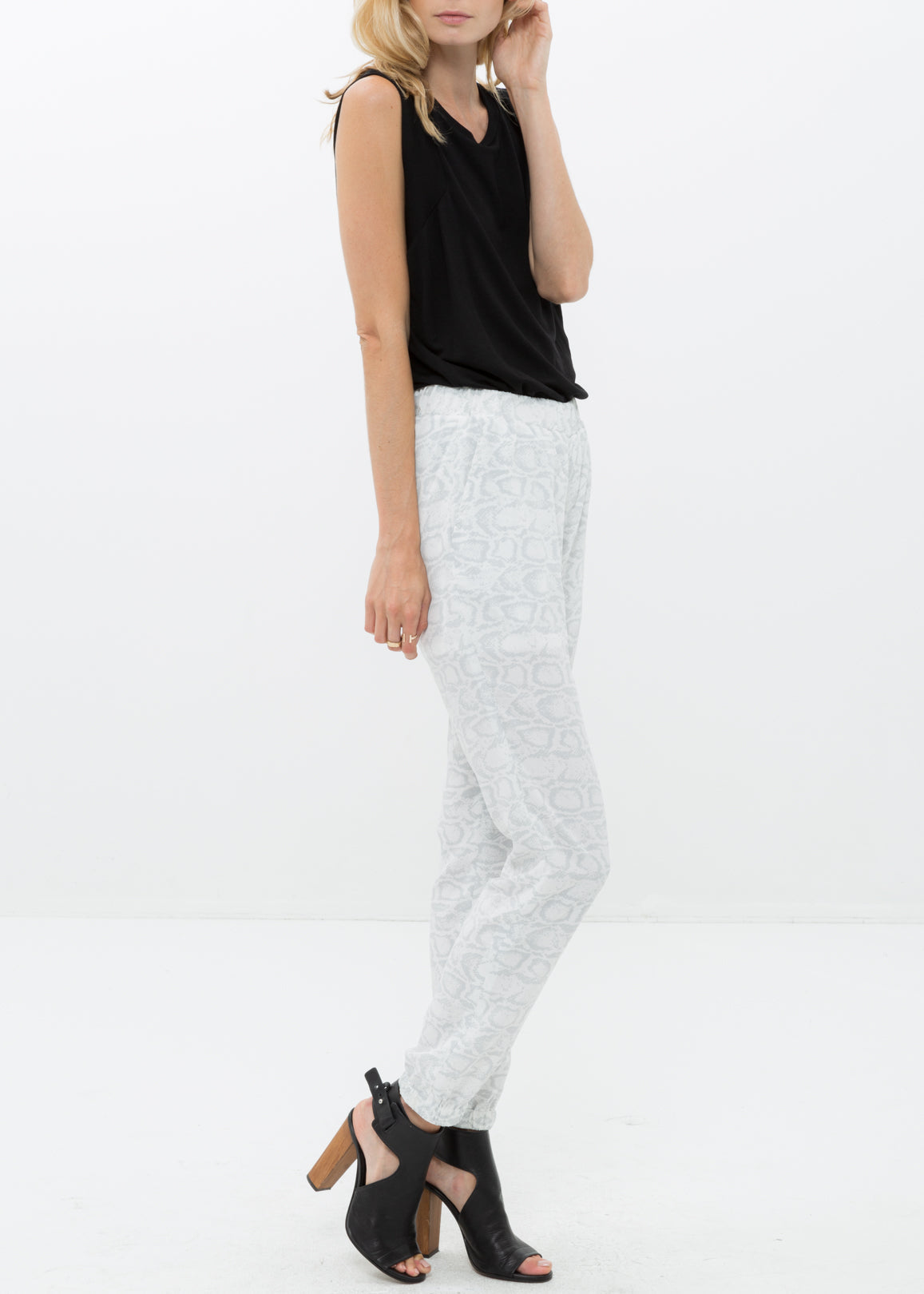 Side view of Women&#39;s High Waist Printed Pants In Ivory Silver
