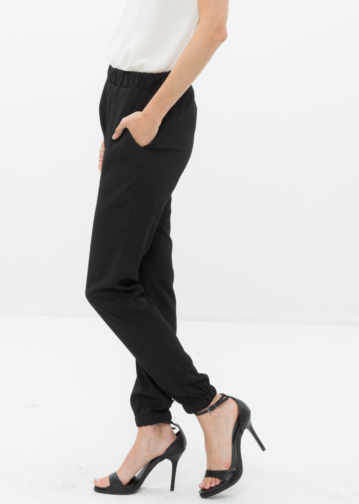 Side view of Women&#39;s Ankle Cuffed Black Crepe Pants In Black