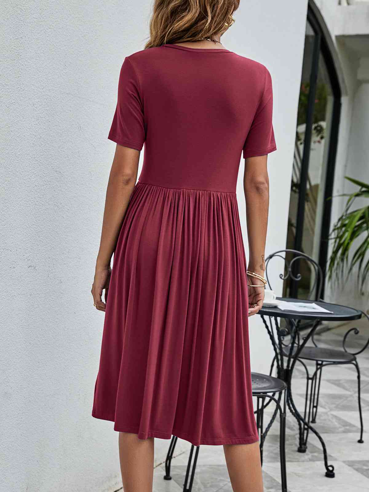 Full view of the back of Button Detail Tee Dress with Pockets-wine